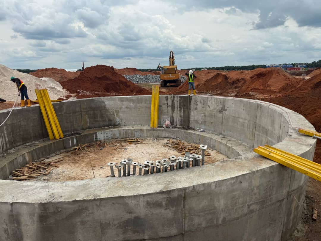 Completed circular reinforced-concrete tank wall with starter bars