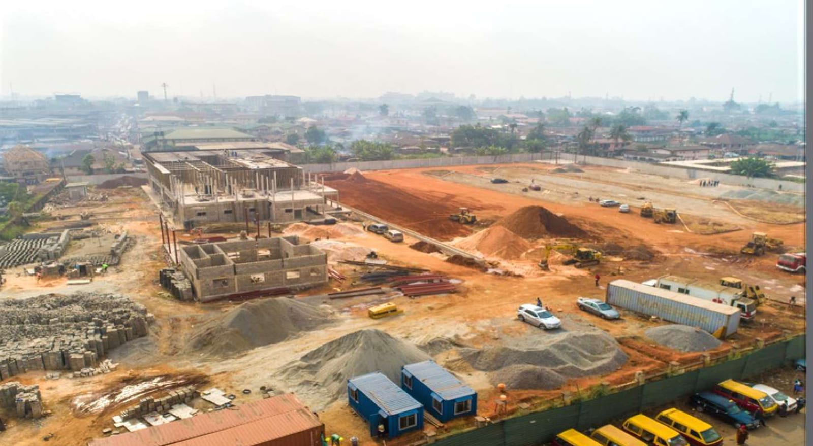 Aerial view of earthworks and early structural works at the Benin Central Bus Terminal site in Obakhavbaye, Benin City